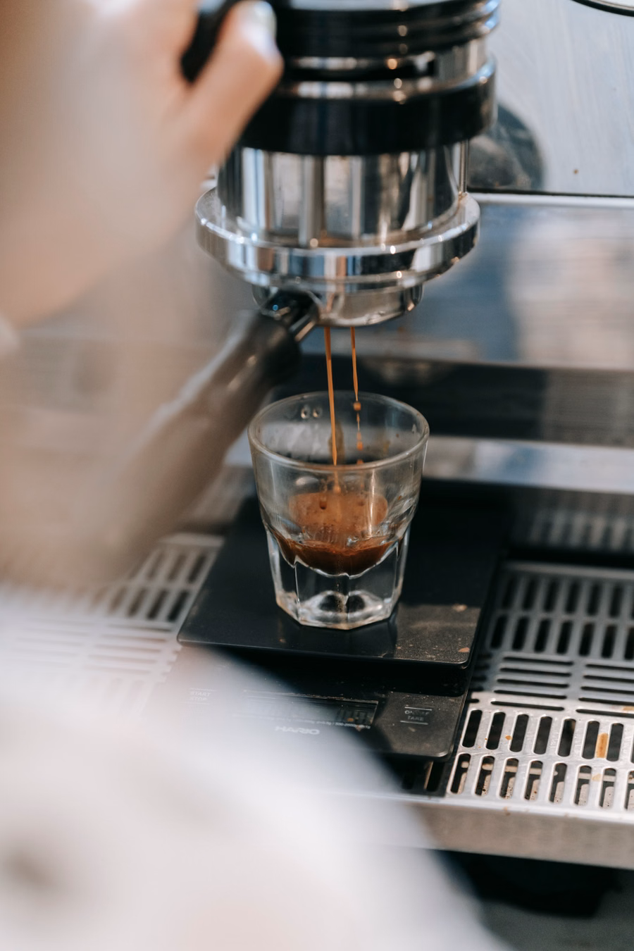Espresso extracting into a glass
